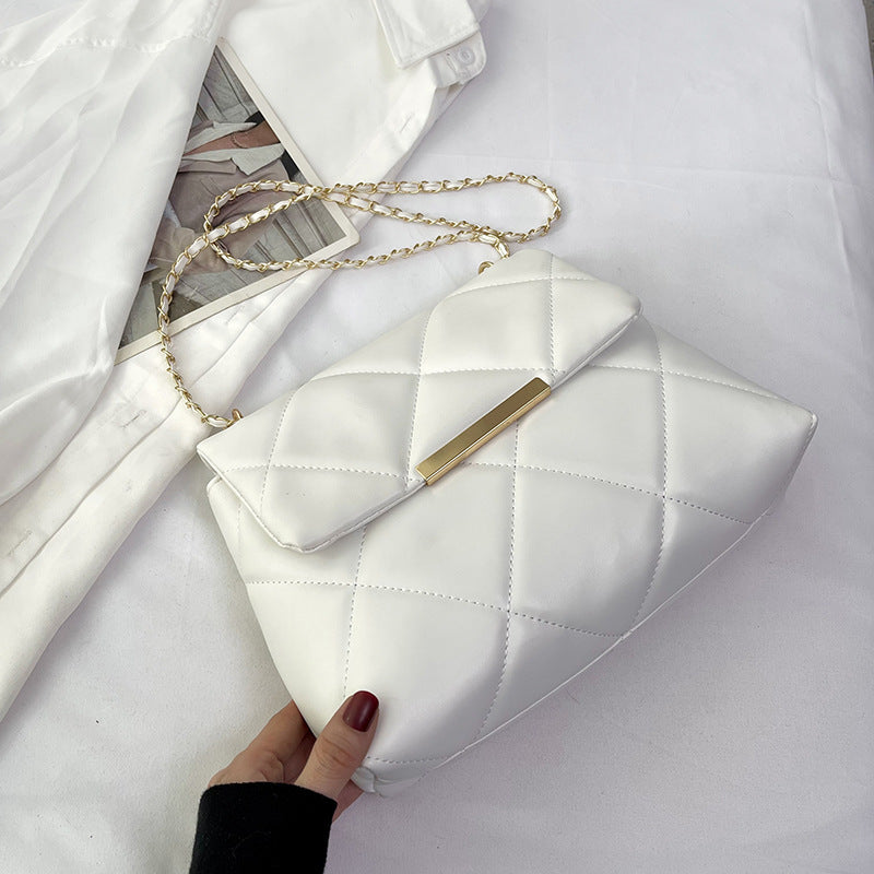 Elegante schoudertas met ketting en diamantpatroon