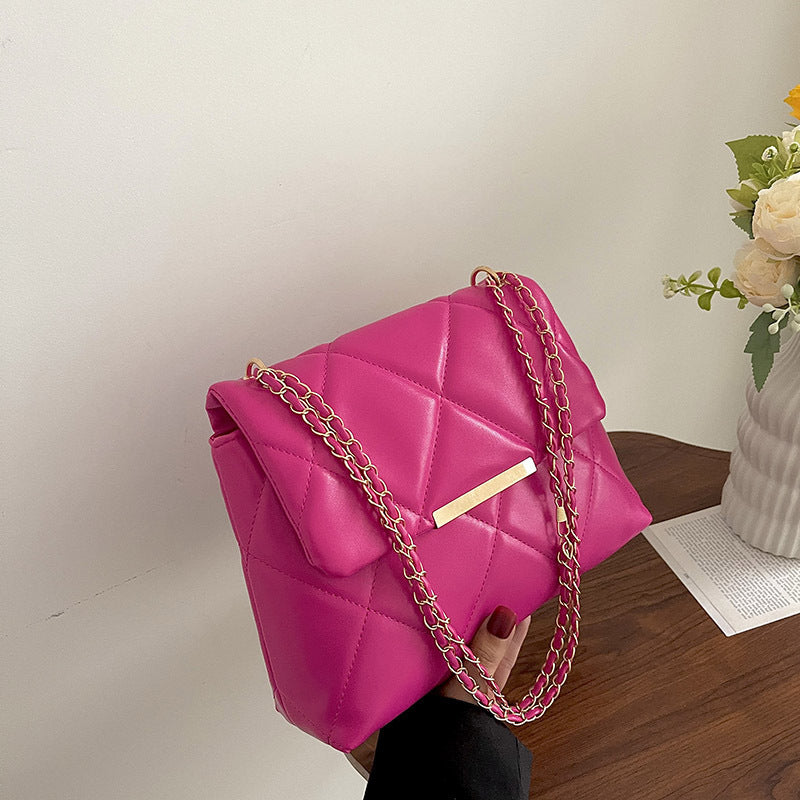 Elegante schoudertas met ketting en diamantpatroon